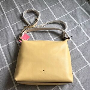 Kate Spade lemon yellow tote bag with two sizes of straps. Never used.